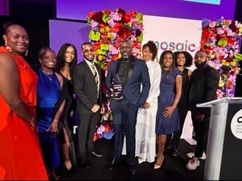 ADW Collective members gathered on stage at an industry awards evening.